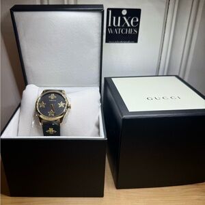 Gucci Women's Watch with Black and Gold Design